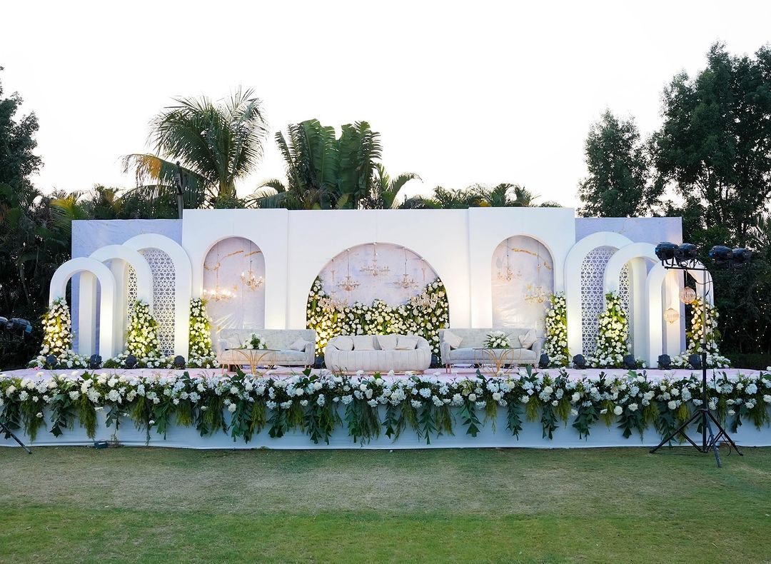 Elegant White Wedding Stage with Multiple Arches