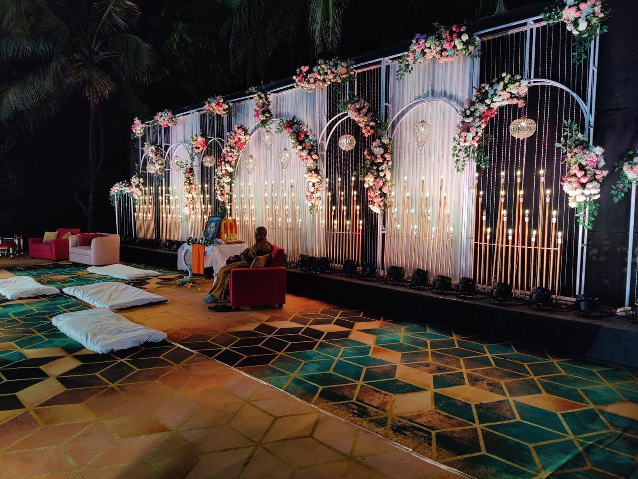 Evening Event with Dramatic Floral Backdrop and Geometric Patterns