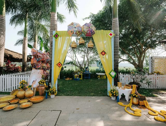 Colorful Outdoor Entrance with Yellow Curtains and Traditional Decor