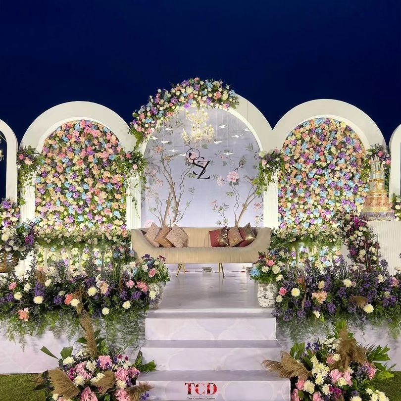 Elegant White Wedding Stage with Arched Backdrop